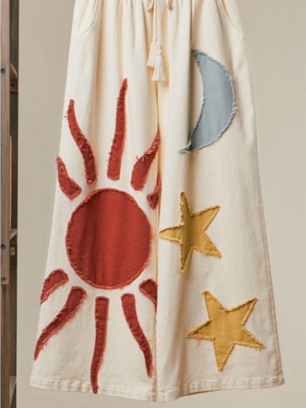 Cream stretch wide leg pant with Sun, Moon & Star Appliqués